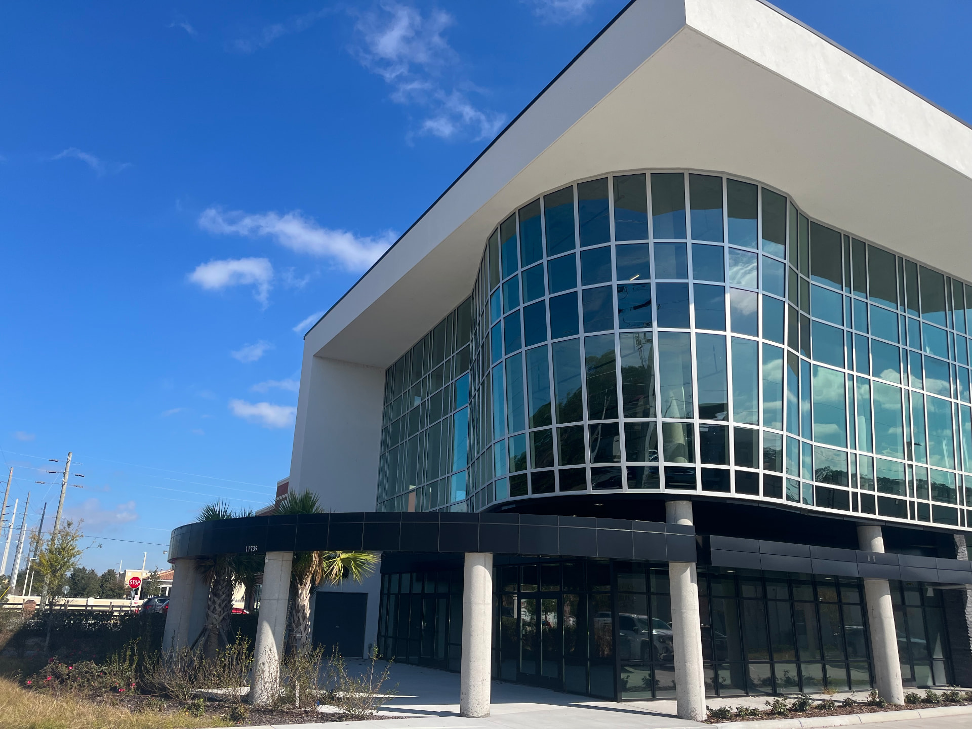 Modern commercial building with reflective tinted glass facade in Central Florida